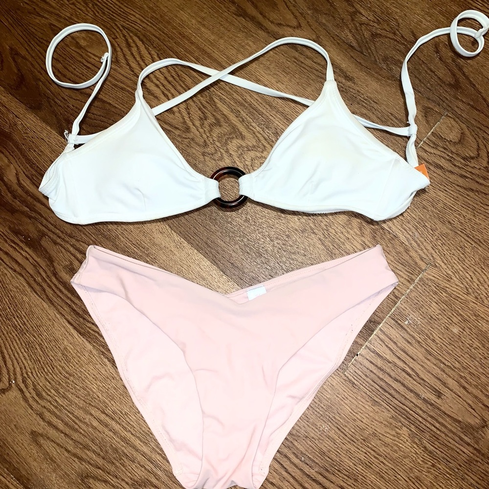 White bikini top and pink bikini bottoms